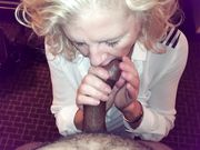 Beautiful mature blonde on her knees blowing a black cock